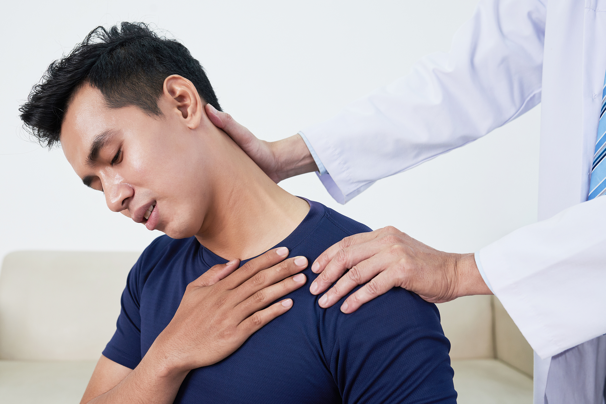 Doctor check patient neck pain